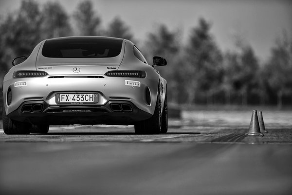 How do you properly maintain and service a convertible top mechanism in the often rainy UK climate?